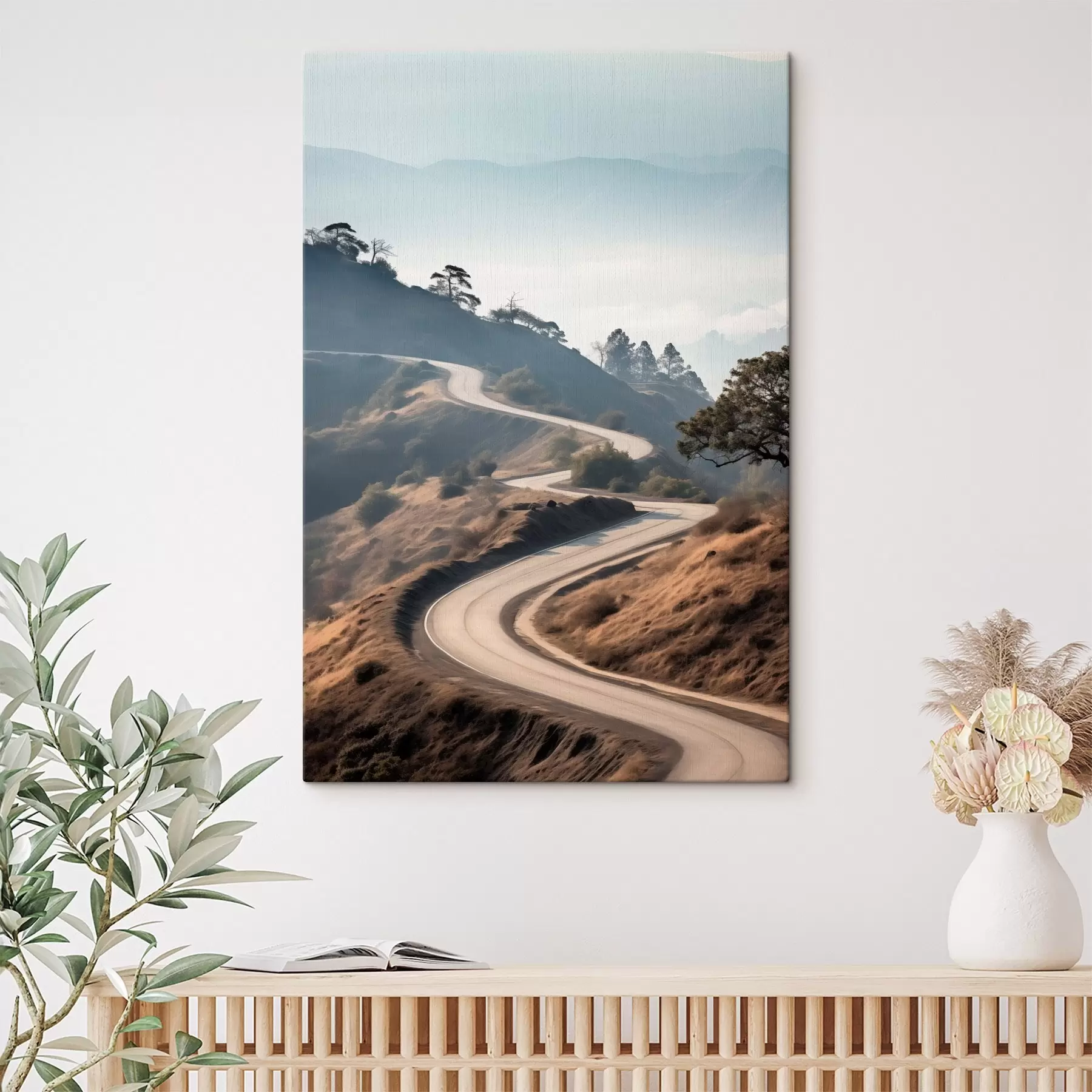 Tableau Une route sinueuse à travers un paysage vallonné recouvert d'herbe sèche, sous un ciel clair, avec des montagnes au loin s46289
