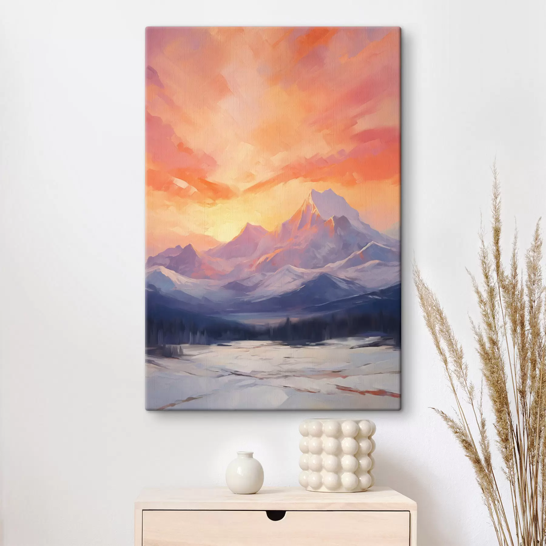 Tableau Des montagnes aux sommets enneigés sous un ciel aux teintes vives d'orange et de rose, parsemé de nuages s48741