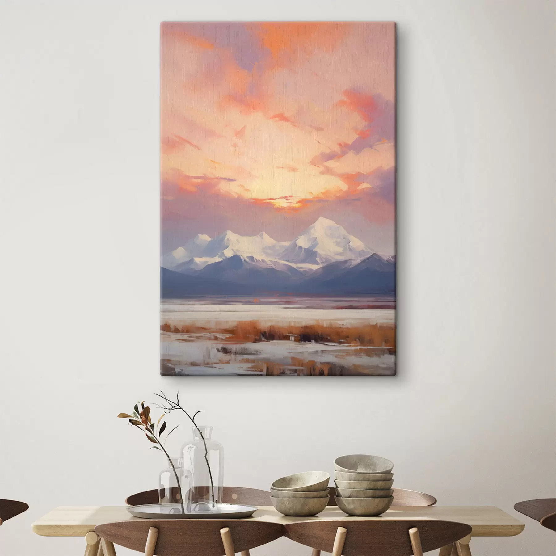 Tableau Des montagnes aux sommets enneigés sous un ciel aux teintes vives d'orange et de rose, parsemé de nuages s48742